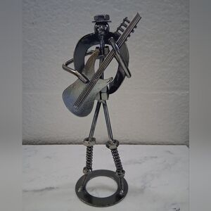 Handmade Metal Sculpture of a Musician Playing a Guitar